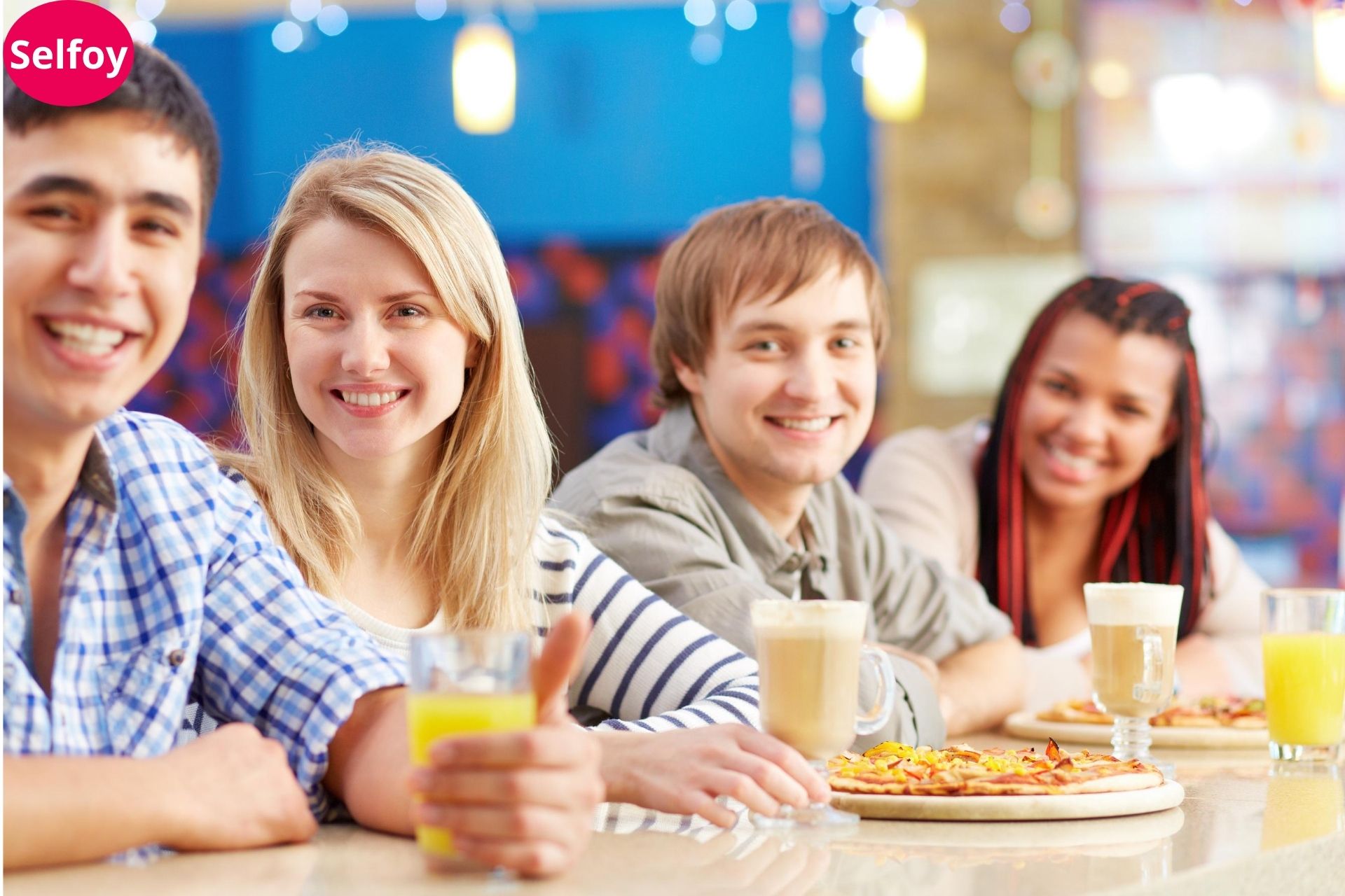  Good Personal Hygiene Helps to Develop Positive Self Esteem, two girls and two boys have a drink and pizza on their table and all are smiling