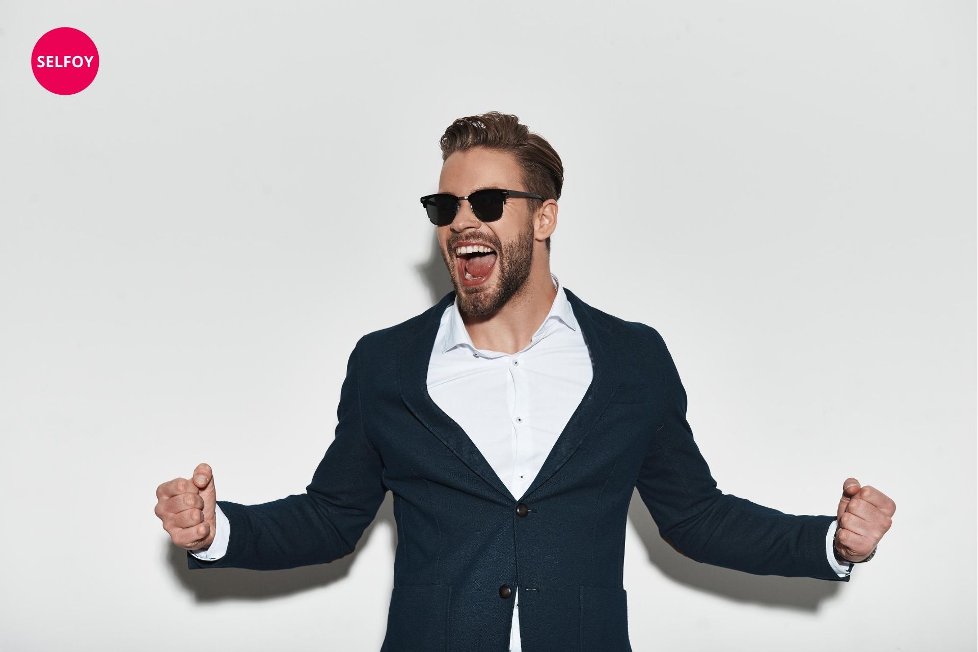 man wearing a black suit and black goggle cheering up